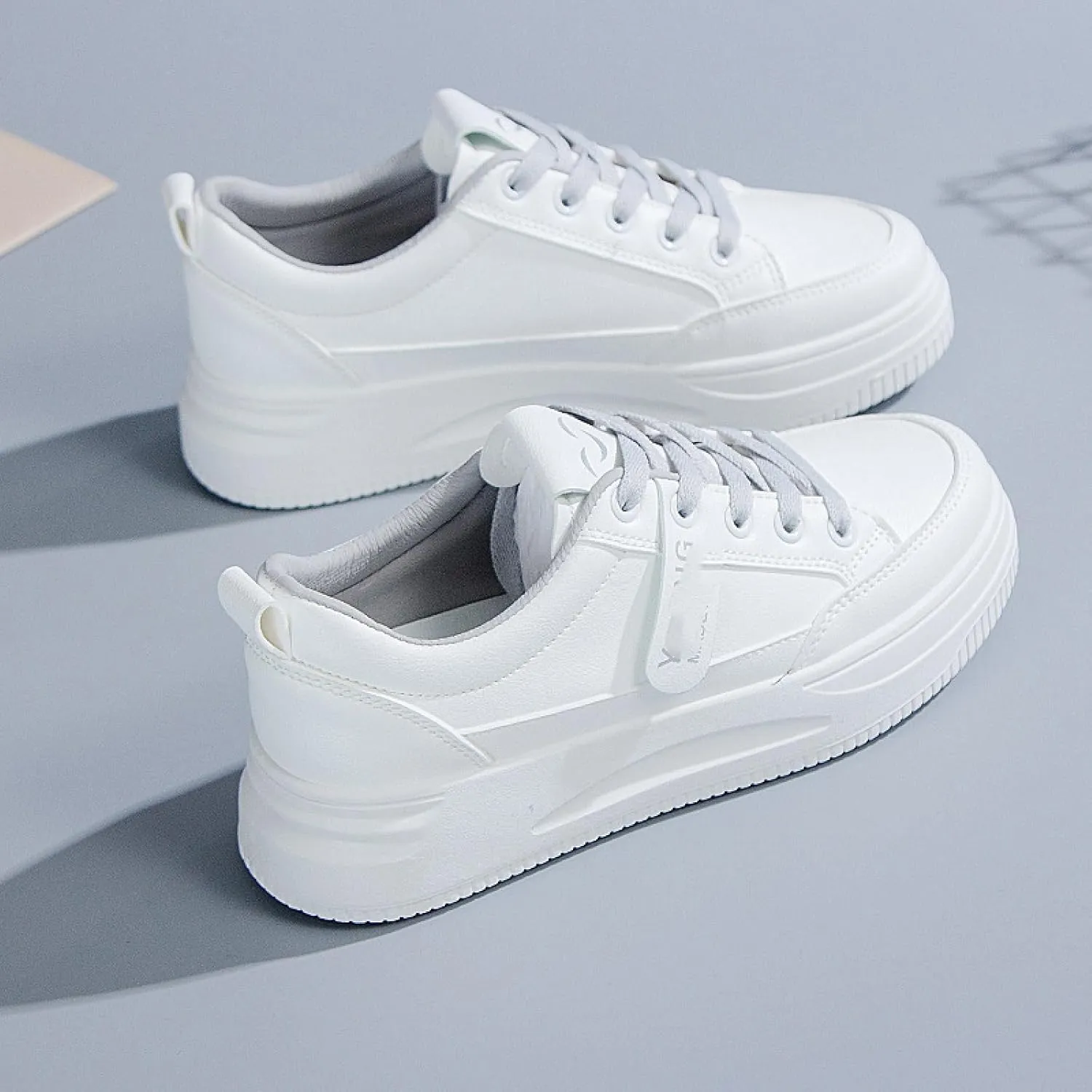 Small White Shoes and Sports Board Shoes